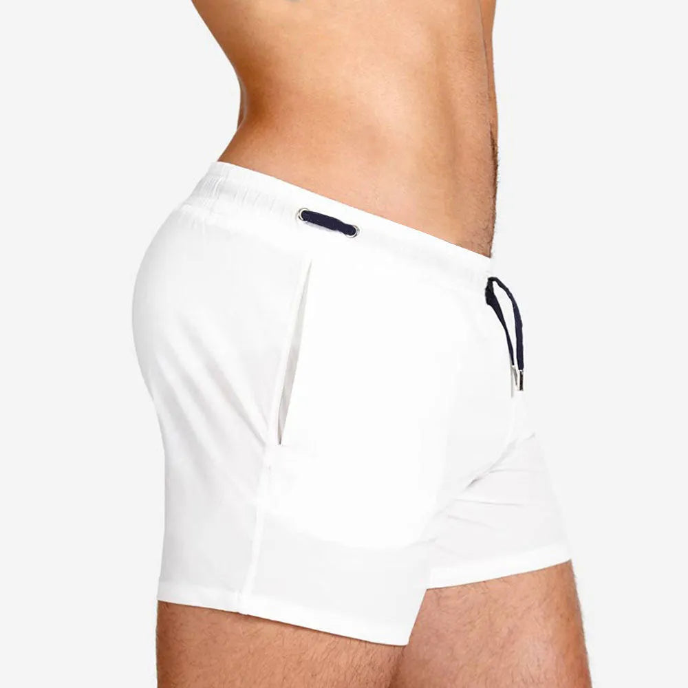 Polyester sports shorts with mesh lining in multiple colours including army green and rose red.