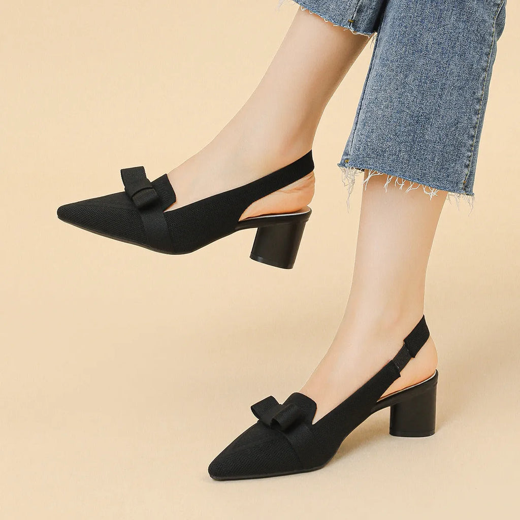 Women's closed toe high heel sandals with bow detail and ankle buckle back strap in solid summer colours