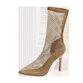 Gold high heel sandals with pointed stiletto design and mesh upper material