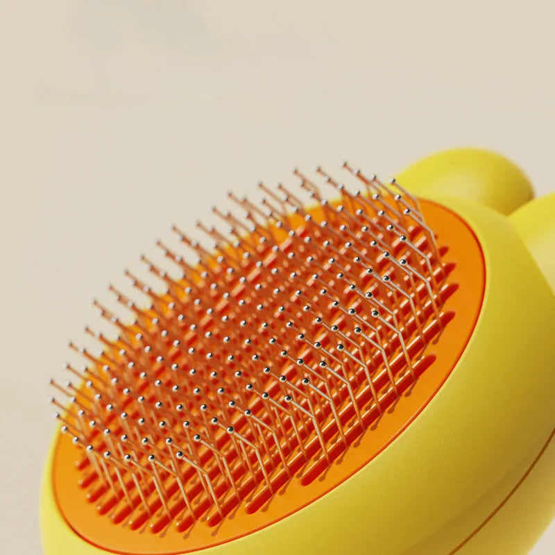 Self cleaning pet grooming brush with release button and stainless steel comb