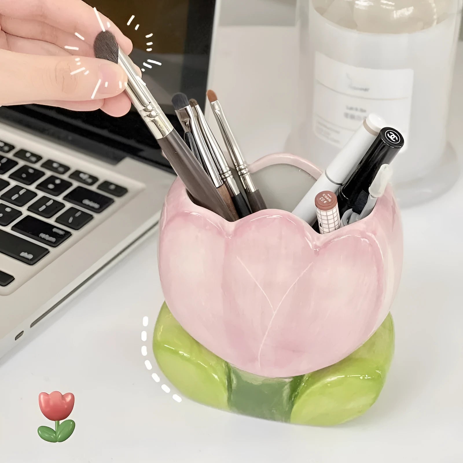 Ceramic tulip-shaped pen holder and storage box in a floral colour pattern on a desk.