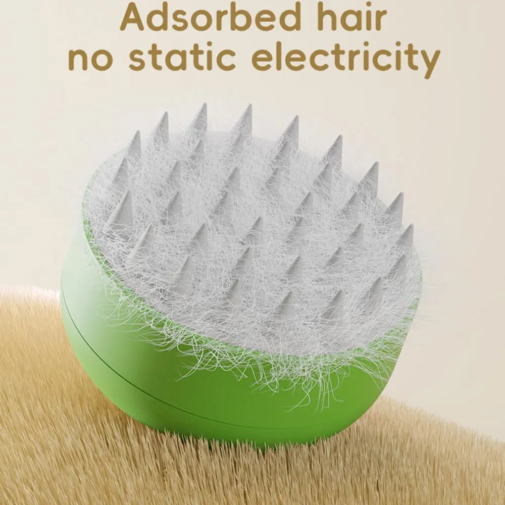 Green and yellow rechargeable silicone steam brush for pet grooming on a table.