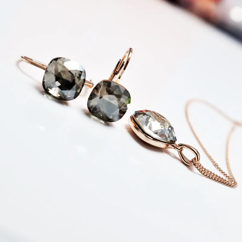Austrian crystal geometric copper ear studs for women in champagne gold colour