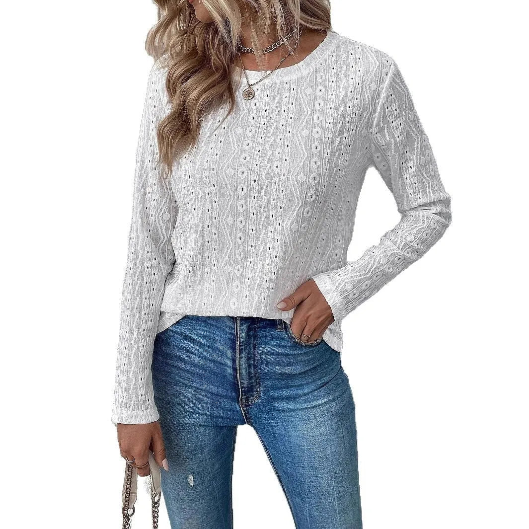 White loose fit long sleeve round neck polyester T-shirt laid flat.