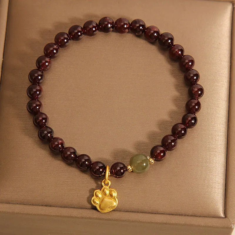 Women's adjustable crystal bracelet with Cat's Paw garnet colouration and original design