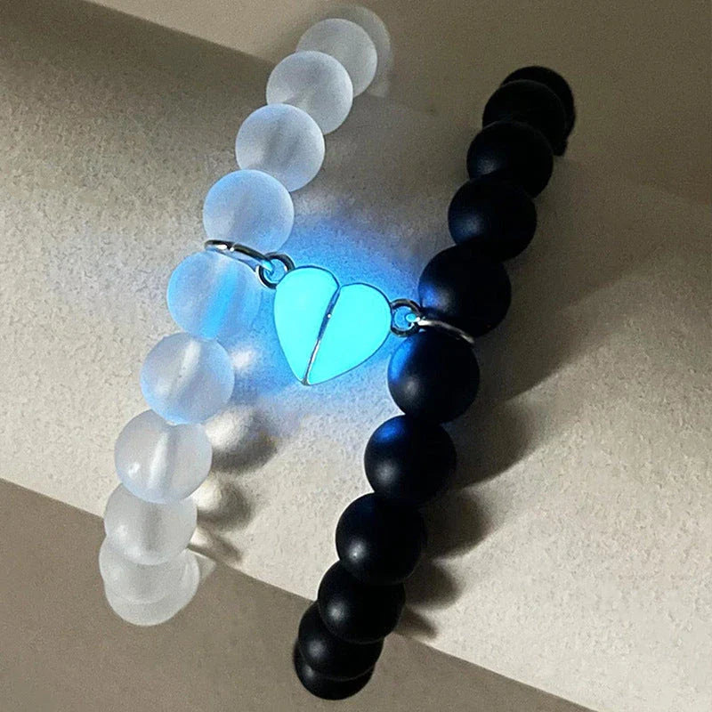 Luminous glow-in-the-dark crown bracelet set in white and black colors, showcasing a unique design and enchanting nighttime glow