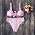 Women's polyester bikini set in black, pink, red, white or wine red with matching bra and panties