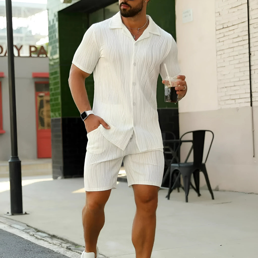 Men's black short sleeve shorts suit with wave pattern texture on cotton blend fabric.