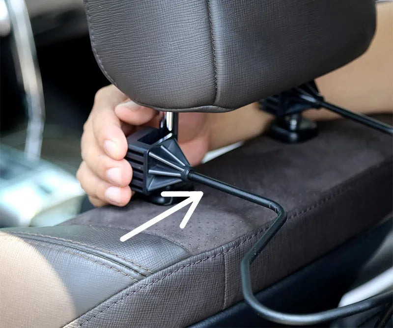 Black metal snap-on hat bracket mounted on a car rearview mirror