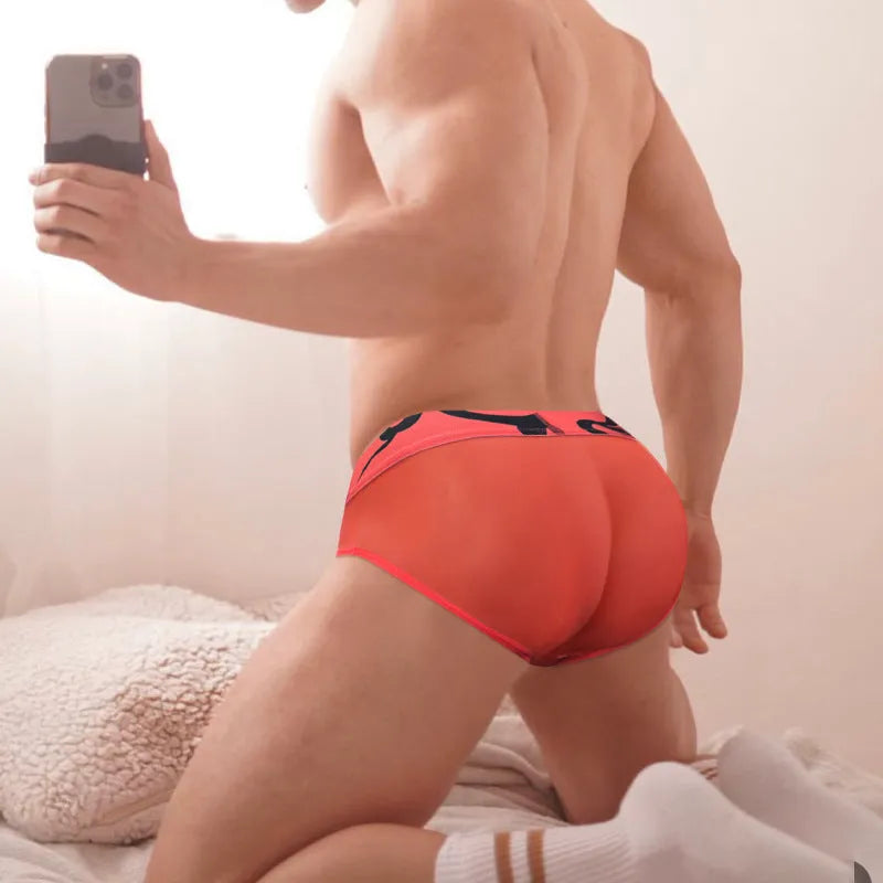 Men's solid colour modal boxer shorts on a white background, showing low waist style.