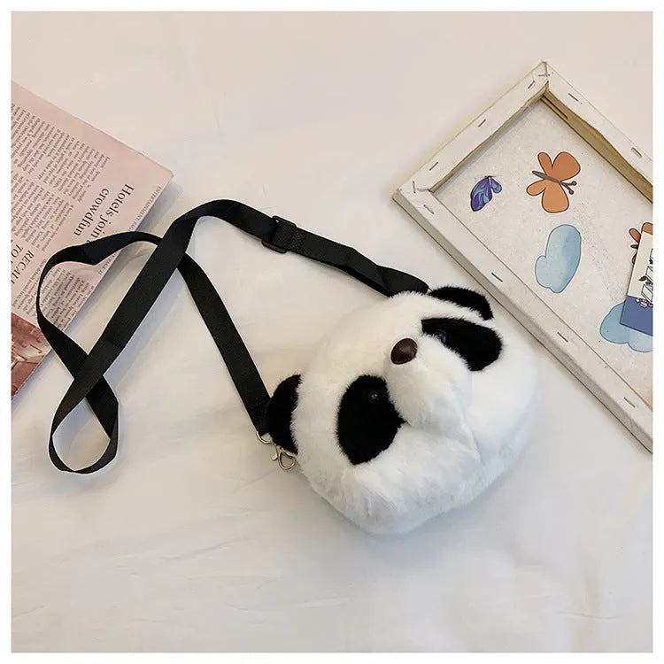 Soft plush panda head design cylindrical crossbody messenger bag with a sandwich pocket.