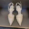 Women's black hollow stiletto heel pump shoe with pointed toe and red sole on a white background.