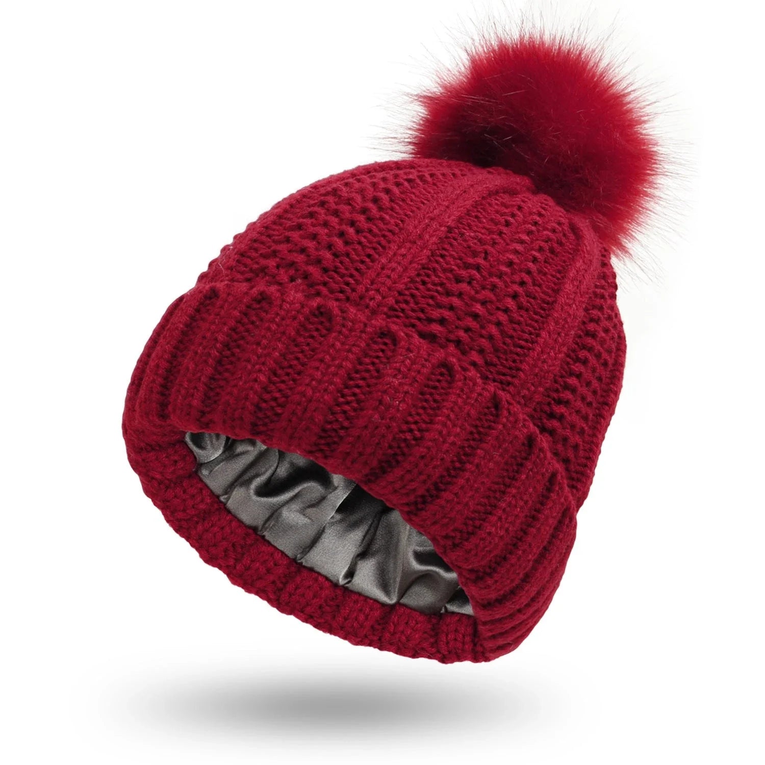 Cozy satin-lined knit beanies with pom poms in various colors for women's winter fashion