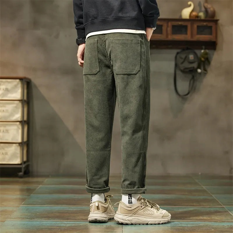 Men's corduroy casual trousers in tapered straight-leg style with mid waist and zip fly