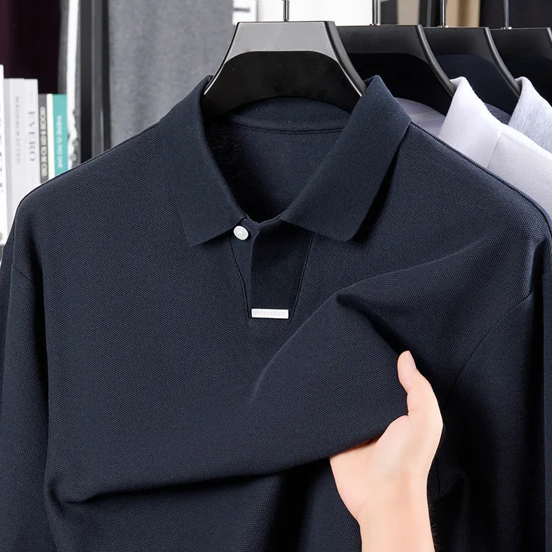 Man wearing a gray loose-fit long sleeve cotton polo shirt with lapel collar.