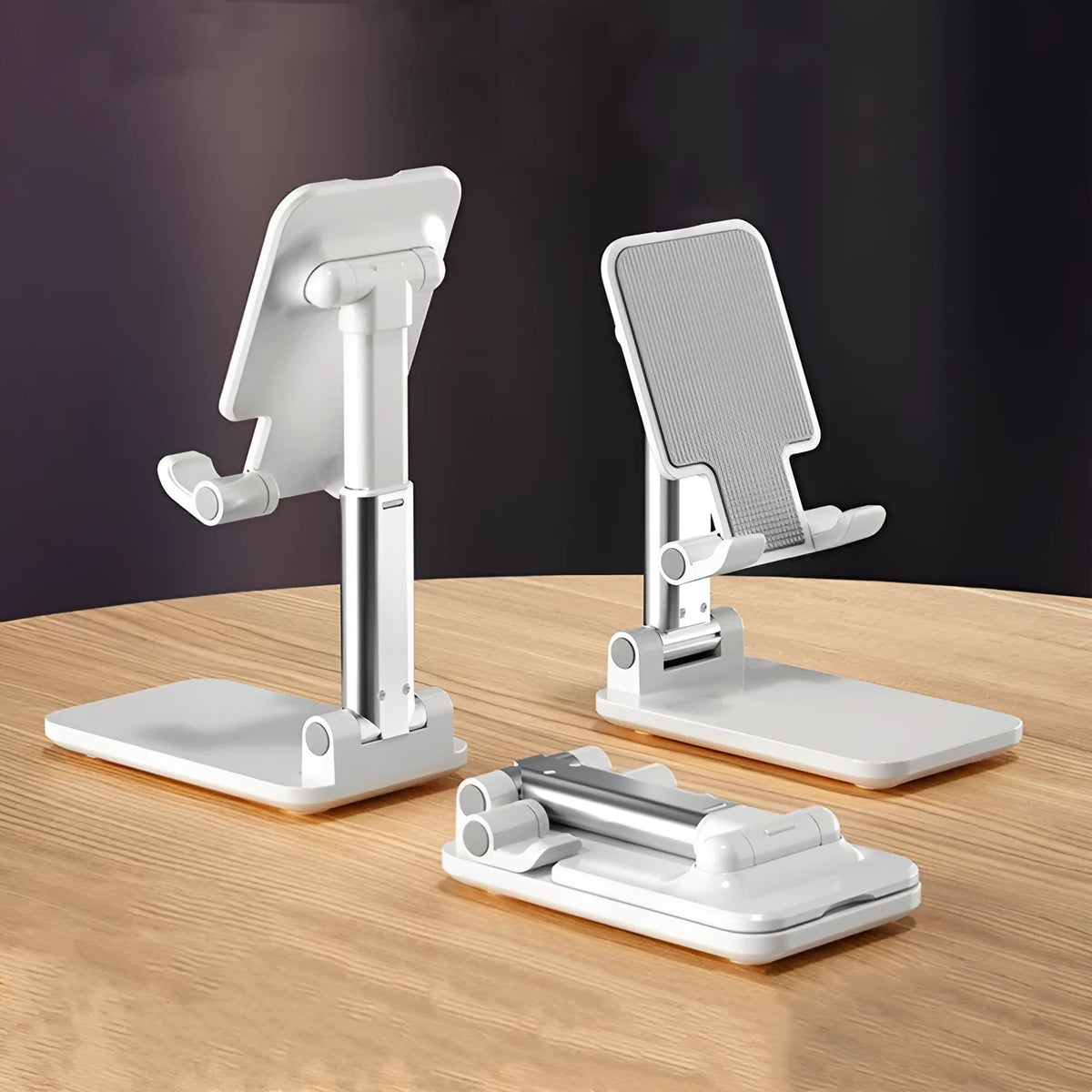 Universal folding telescopic mobile phone bracket stand in blue on a desktop, showing anti-skid silicone pad.