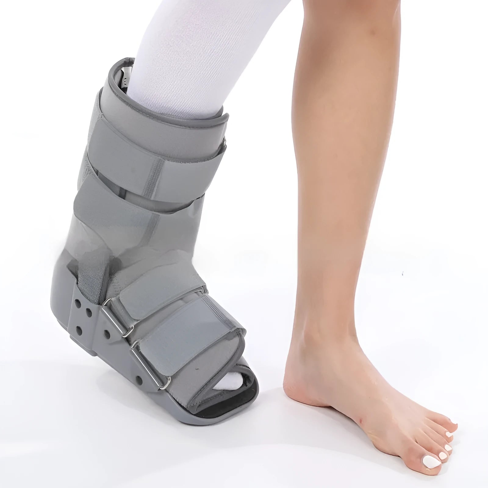 Grey and black adjustable Achilles tendon rehabilitation walking boot with plastic shell and straps.