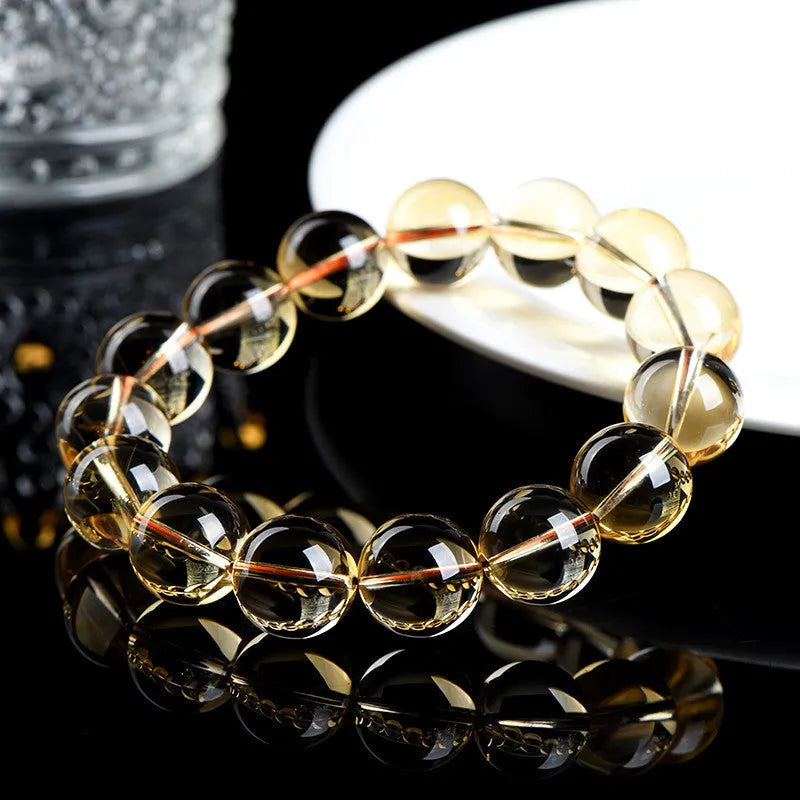 Natural citrine scattered beads ball bracelet in 7A grade colour on a wrist.