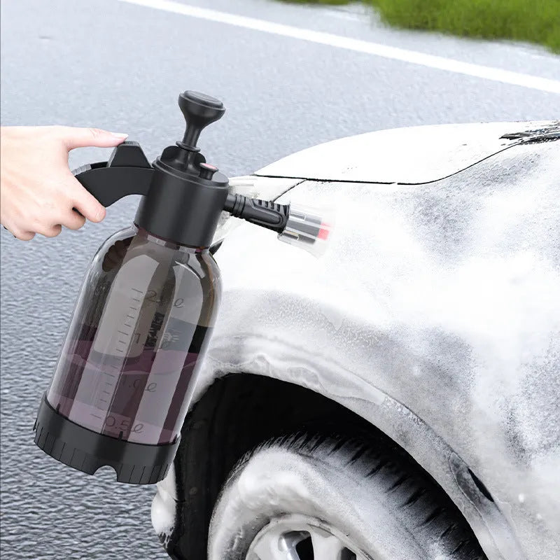 Black 2L hand-held foam watering can sprayer with ergonomic handle and pump mechanism.