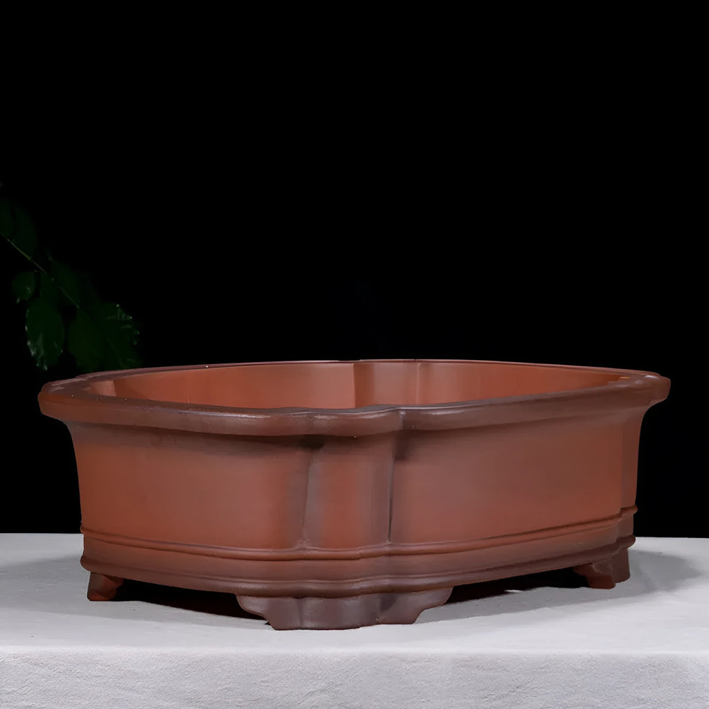 Large antique finish purple clay flowerpot with carved tree stump design featuring pine, cypress, pomegranate, golden marble and crabapple motifs