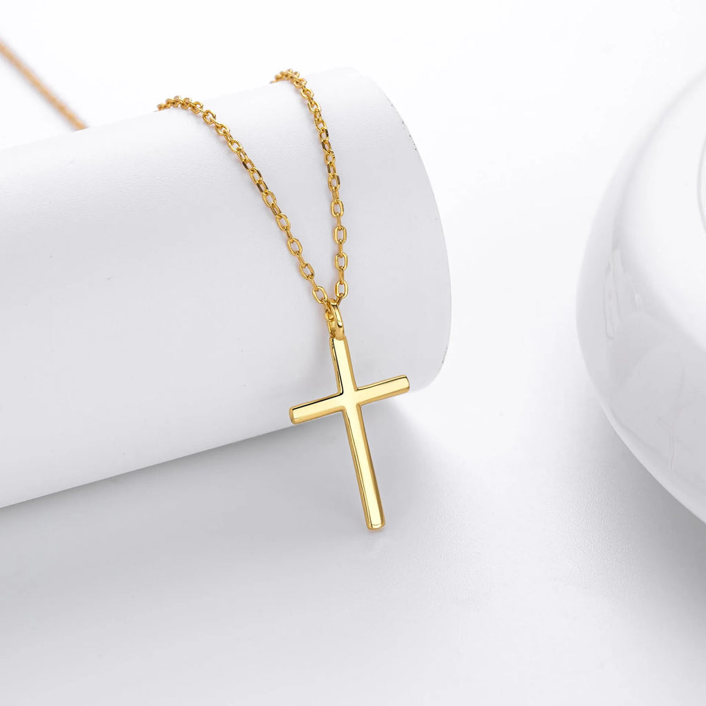 Simple glossy cross pendant on an O-shaped sterling silver chain necklace.