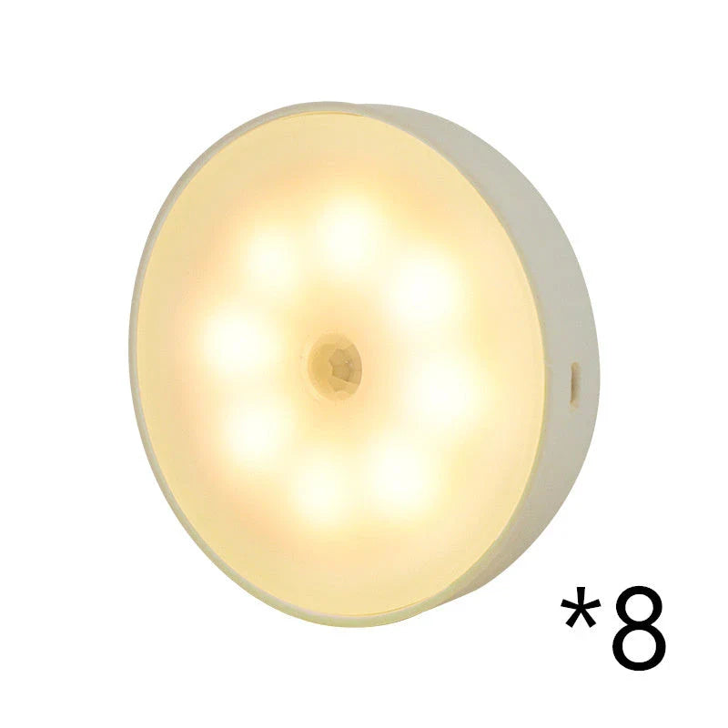 USB rechargeable motion sensor LED puck light for cabinets and night use