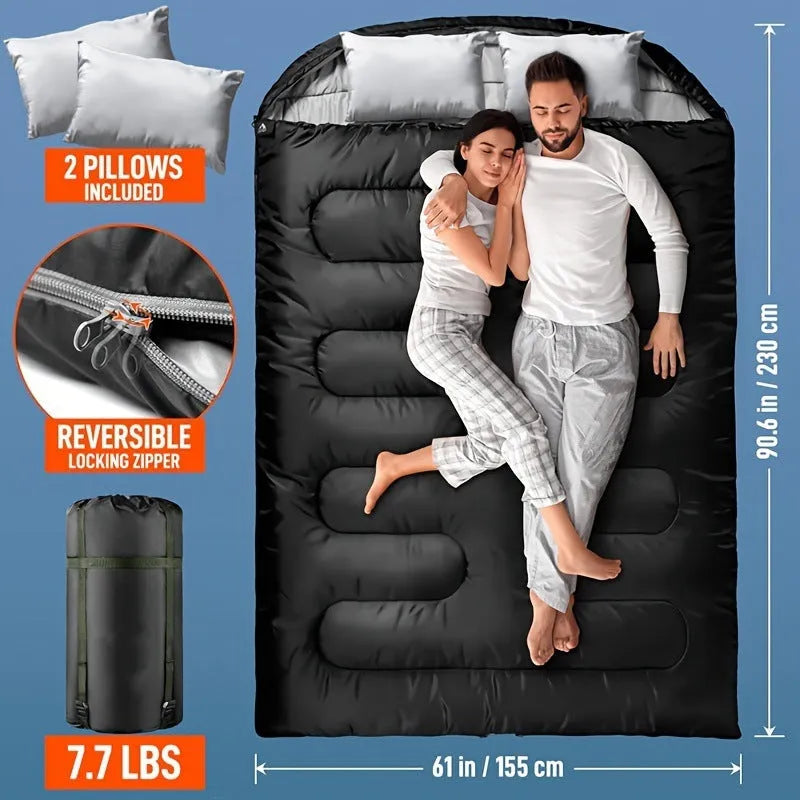 Seven-in-one pillow size sleeping bag in black double, folded to compact cushion shape on outdoor ground