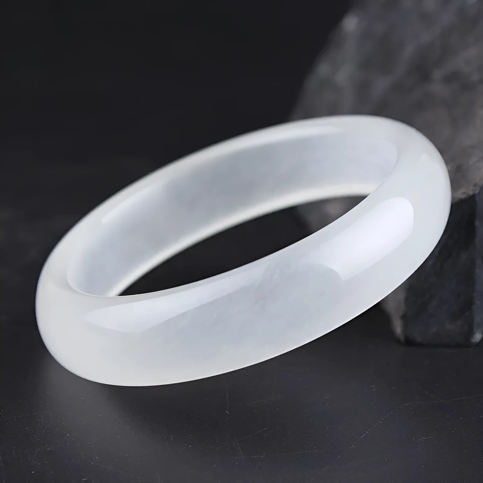 Minimalist jade bracelet in Ice-like White Moonlight colour showing both flat rod and round rod profile options