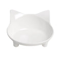 Black shallow cat food bowl with non-slip rubber base on kitchen floor