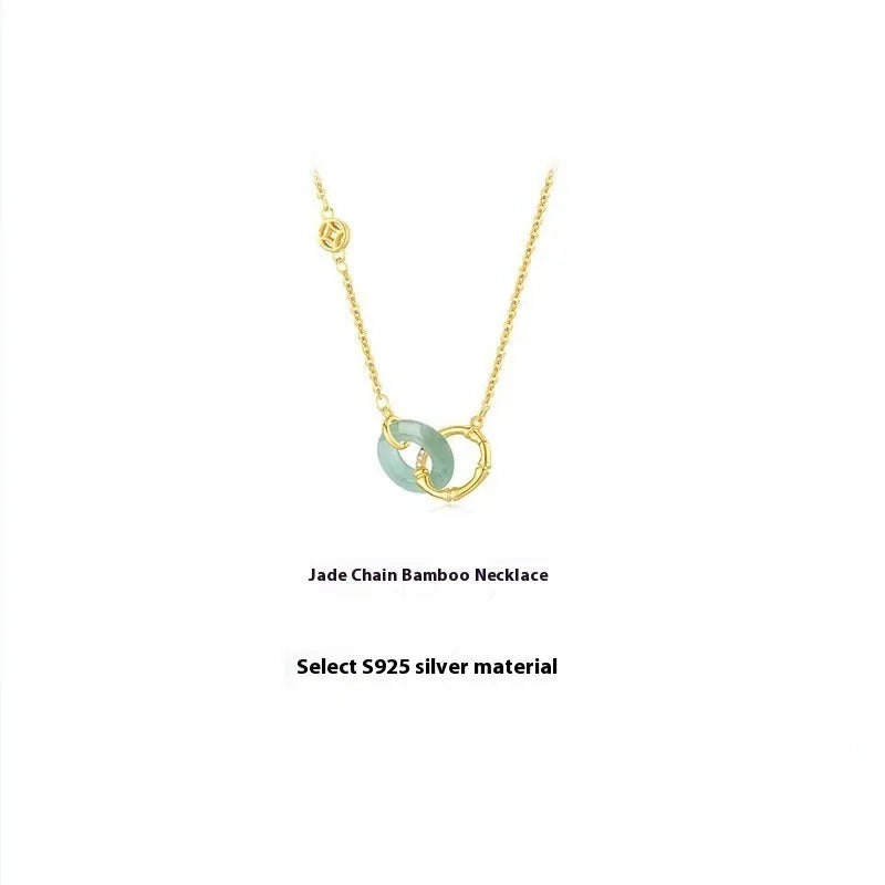 Handmade sterling silver bamboo joint peace buckle necklace with pearl details on an O-chain.