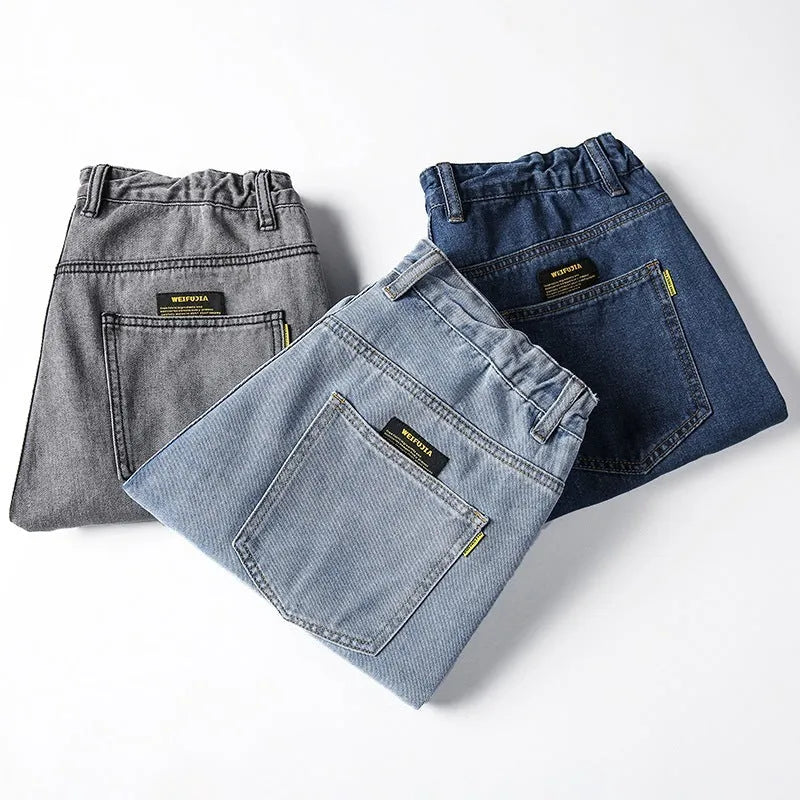Men's loose straight jeans in dark blue, light blue and grey colours showing simple casual style
