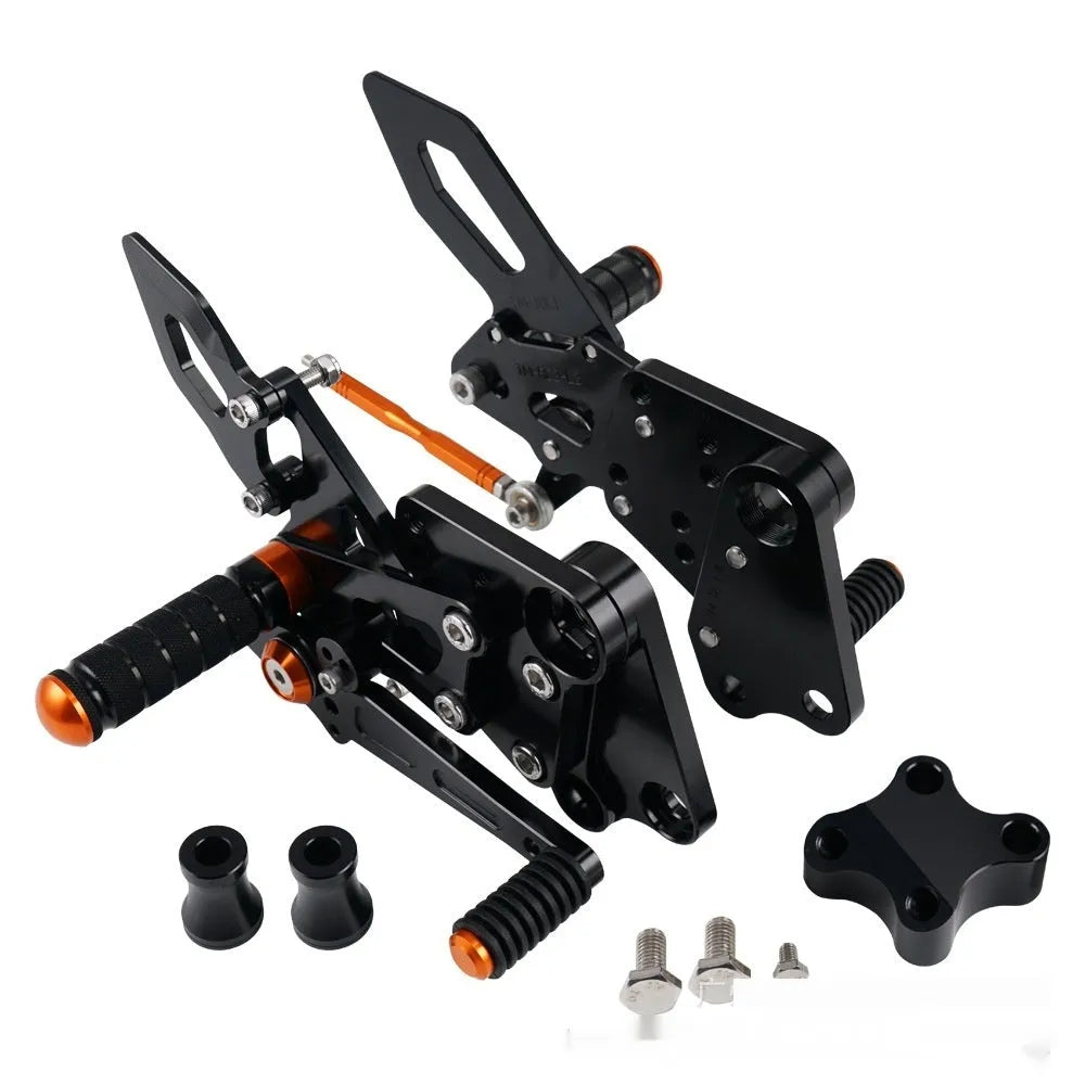 KTM DUKE motorcycle raised footrest relocation kit in black and orange colours