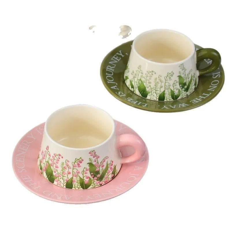 Ceramic coffee cup and saucer set with two mugs, plates, and spoons in couple designs