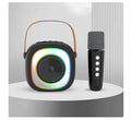 Wireless black and wheat coloured Bluetooth karaoke microphone with card slot and USB port.