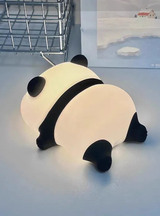 Cute silicone night light sheep cartoon bedroom lamp with warm light, rechargeable, on a bedside table