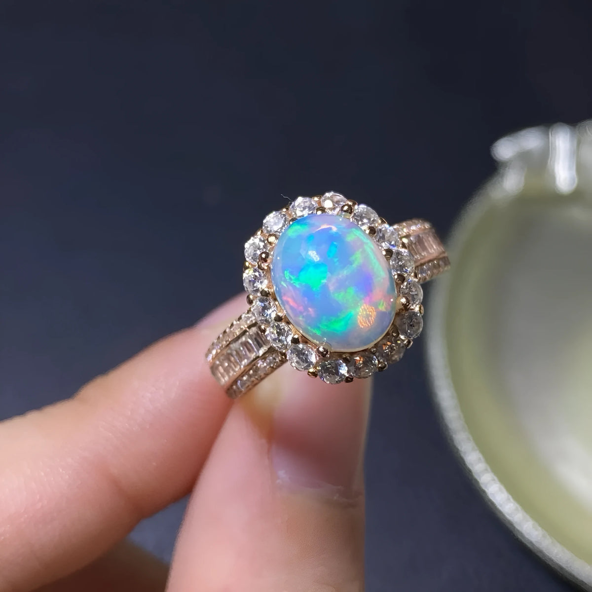 Handmade adjustable opal ring on a sterling silver open band with gold tone plating.