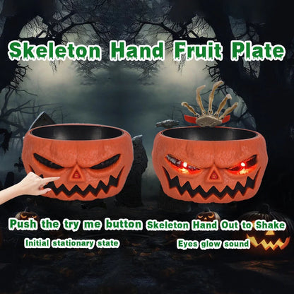 Motion-activated Halloween pumpkin candy bowl with spooky skeleton hand and glowing red eyes
