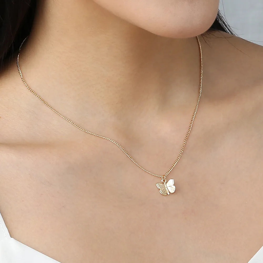 Gold-tone butterfly pendant necklace on a 45cm chain with zinc alloy and electroplate finish