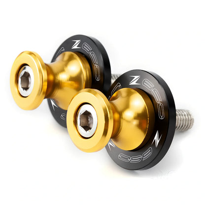 Pair of 8mm CNC aluminium swingarm spools sliders in titanium for Kawasaki Z650 Z900, with Delrin contact and stainless bolts