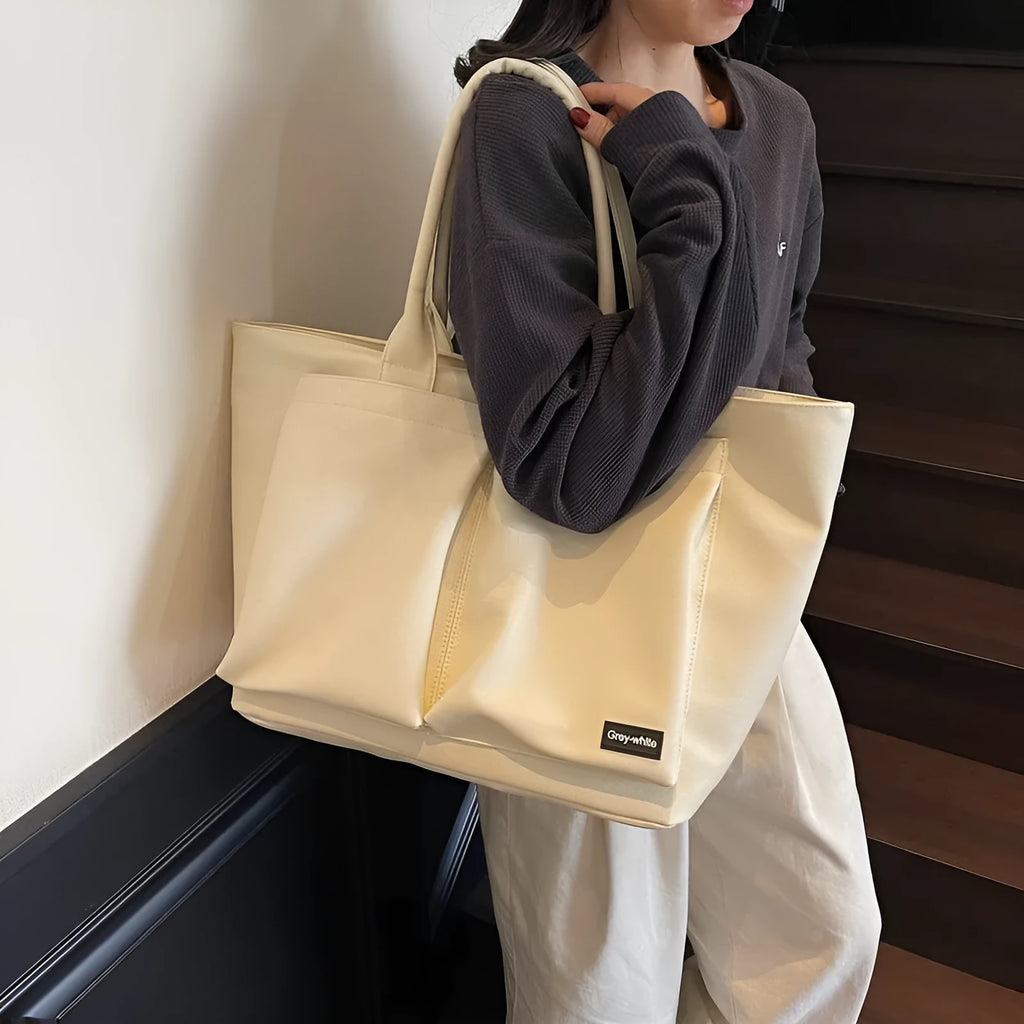 Lightweight sporty shoulder bag in PU material, shown in green colour