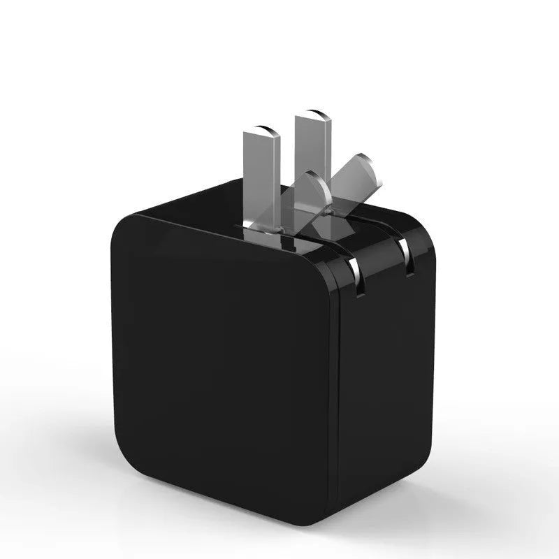 Black 5V 2.4A dual USB travel charger with digital display plugged into a wall socket.