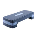Grey ABS plastic aerobic step platform for fitness workouts, showing its size and texture.