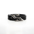 Black men's leather belt with a detailed metal letter buckle on a white background.