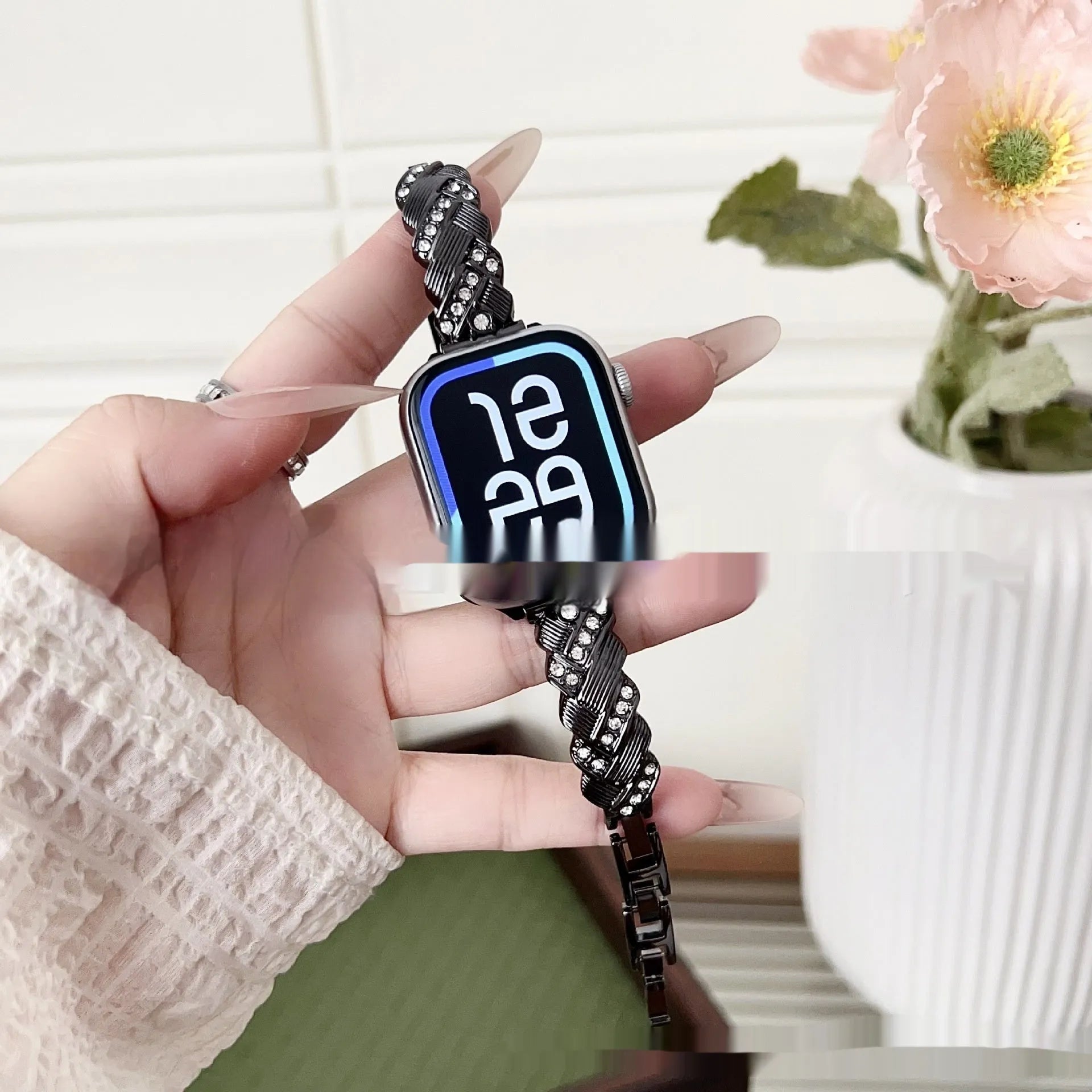 Zinc alloy metal Apple Watch band with twist and diamond design in silver, rose gold, gold, black, and Starlight colours.