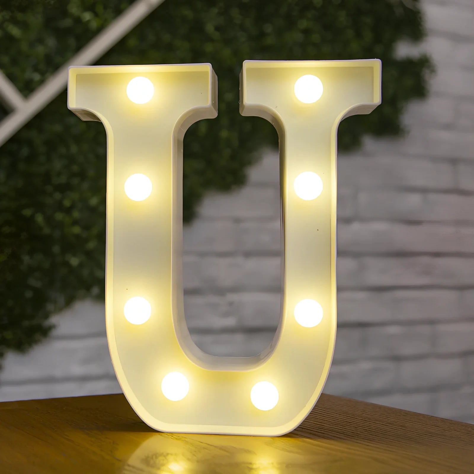 White plastic LED alphabet marquee sign with warm white illumination, 22cm height with battery operation