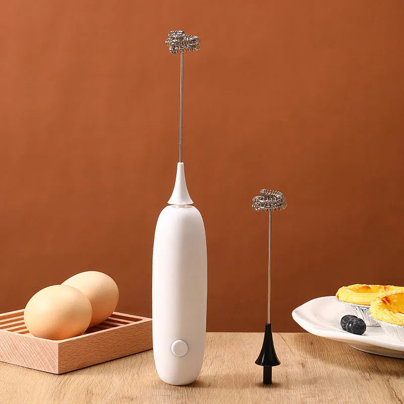Black and white hand-held electric milk frother with blender function for coffee drinks