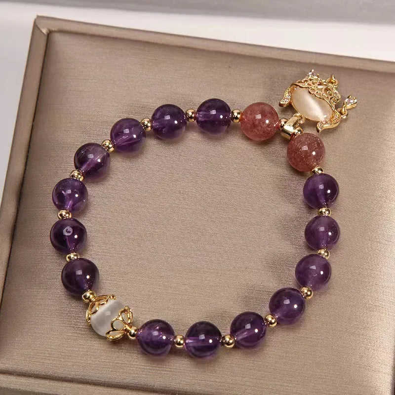 Handmade women's copper bracelet with natural amethyst crystal and gold longevity lock in retro style.