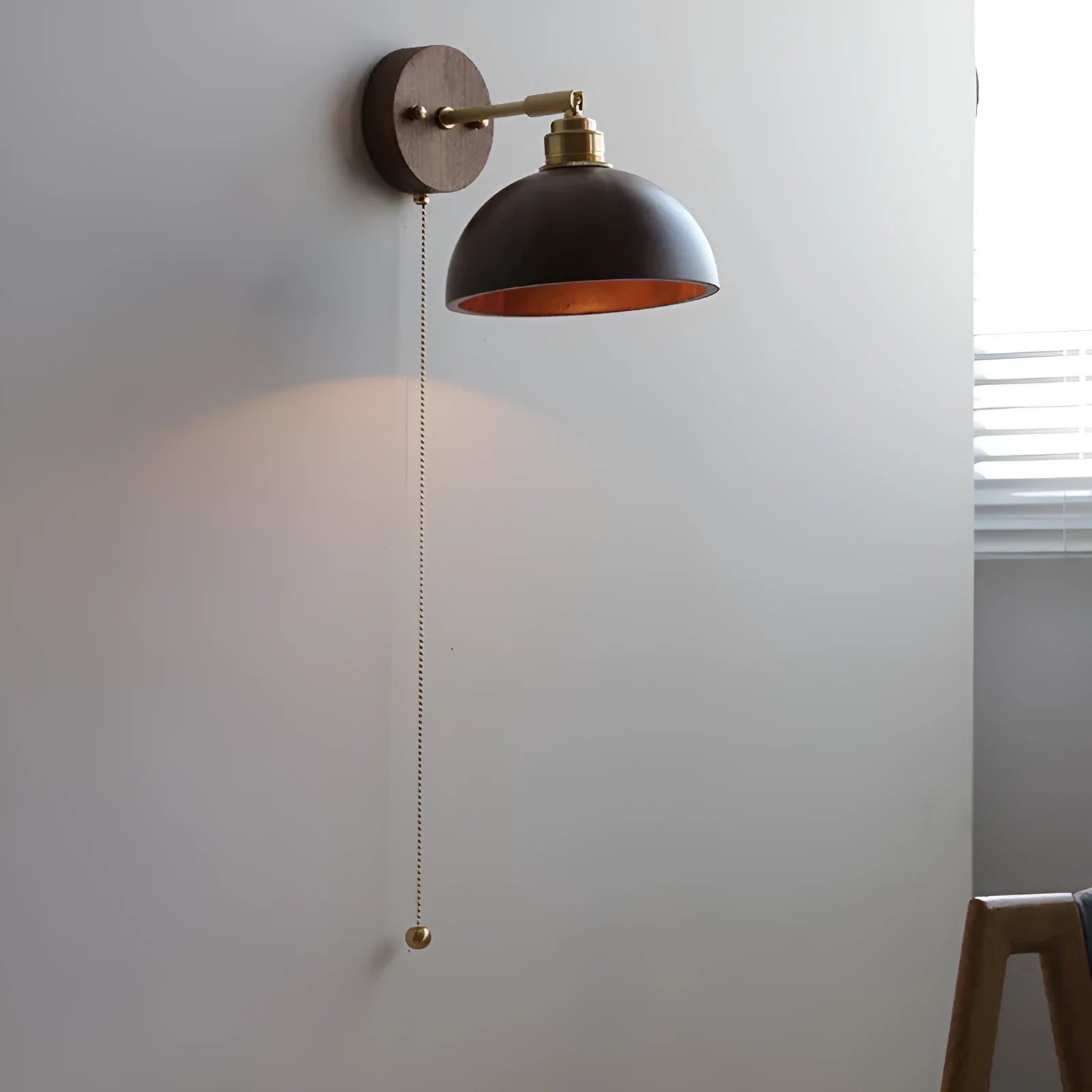Nordic style wooden wall mounted bedside lamp in a bedroom setting