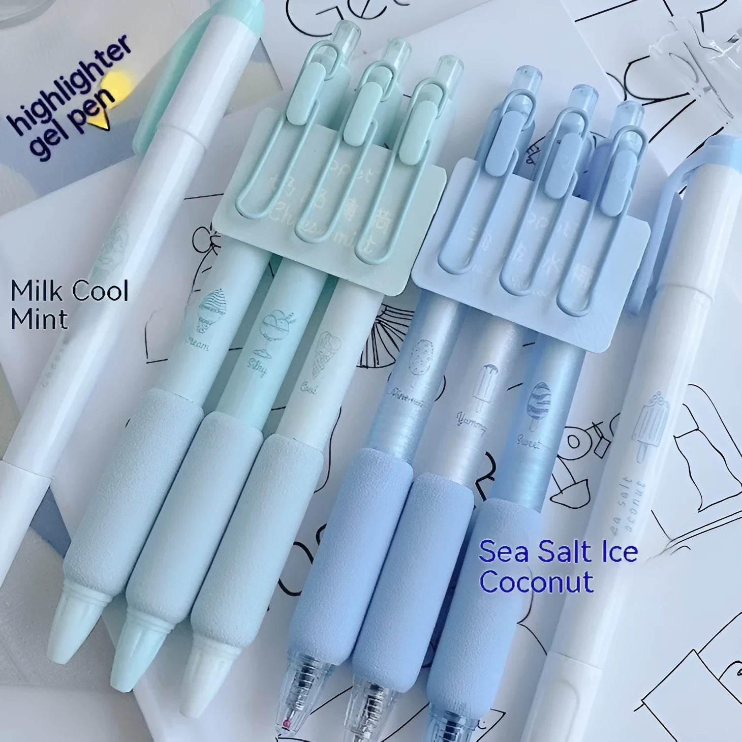 Set of four double-headed fluorescent pens for student calligraphy practice on a desk.