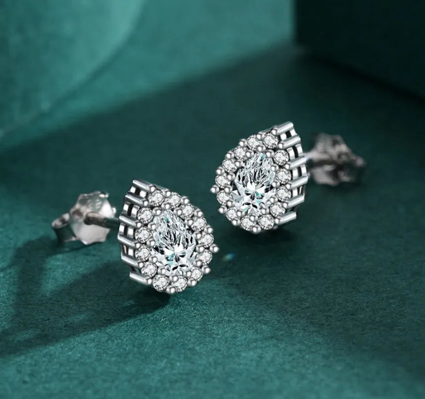 Women's silver drop ear studs with 925 sterling silver construction and diamond treatment finish